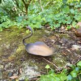 Brass swan pocket emptier