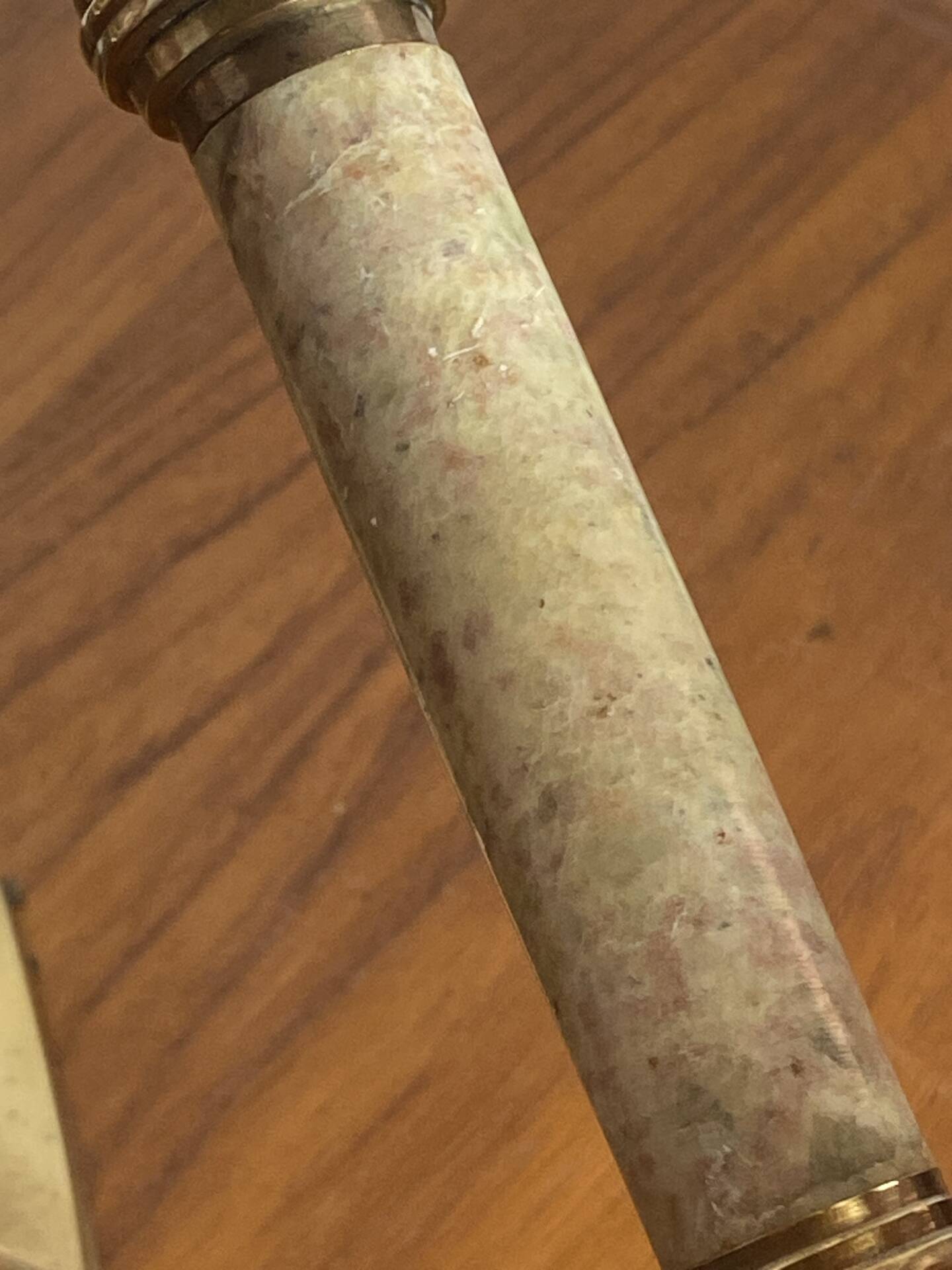 Pair of brass and stone candlesticks