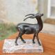 Vintage antelope gazelle bookend in patinated metal on a marble base.