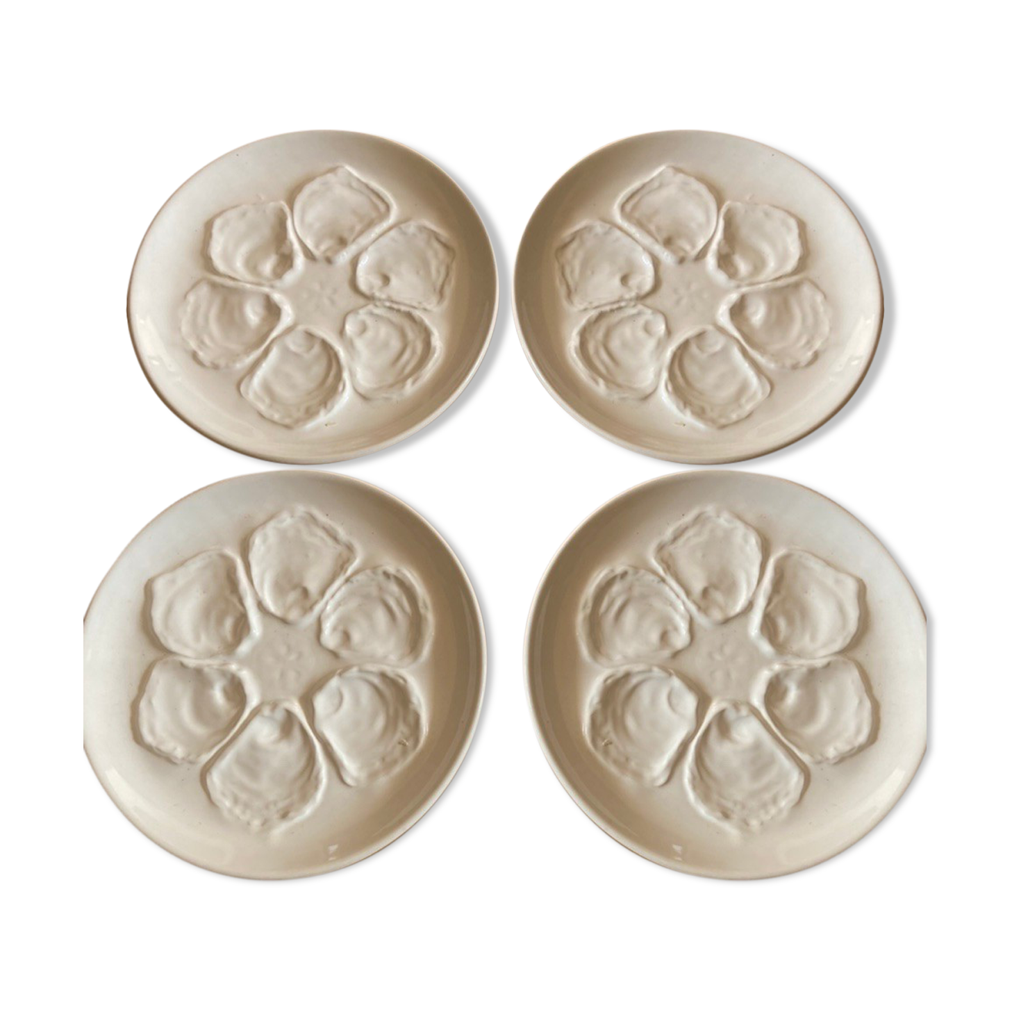 Set of four earthenware oyster plates