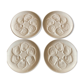 Set of four earthenware oyster plates