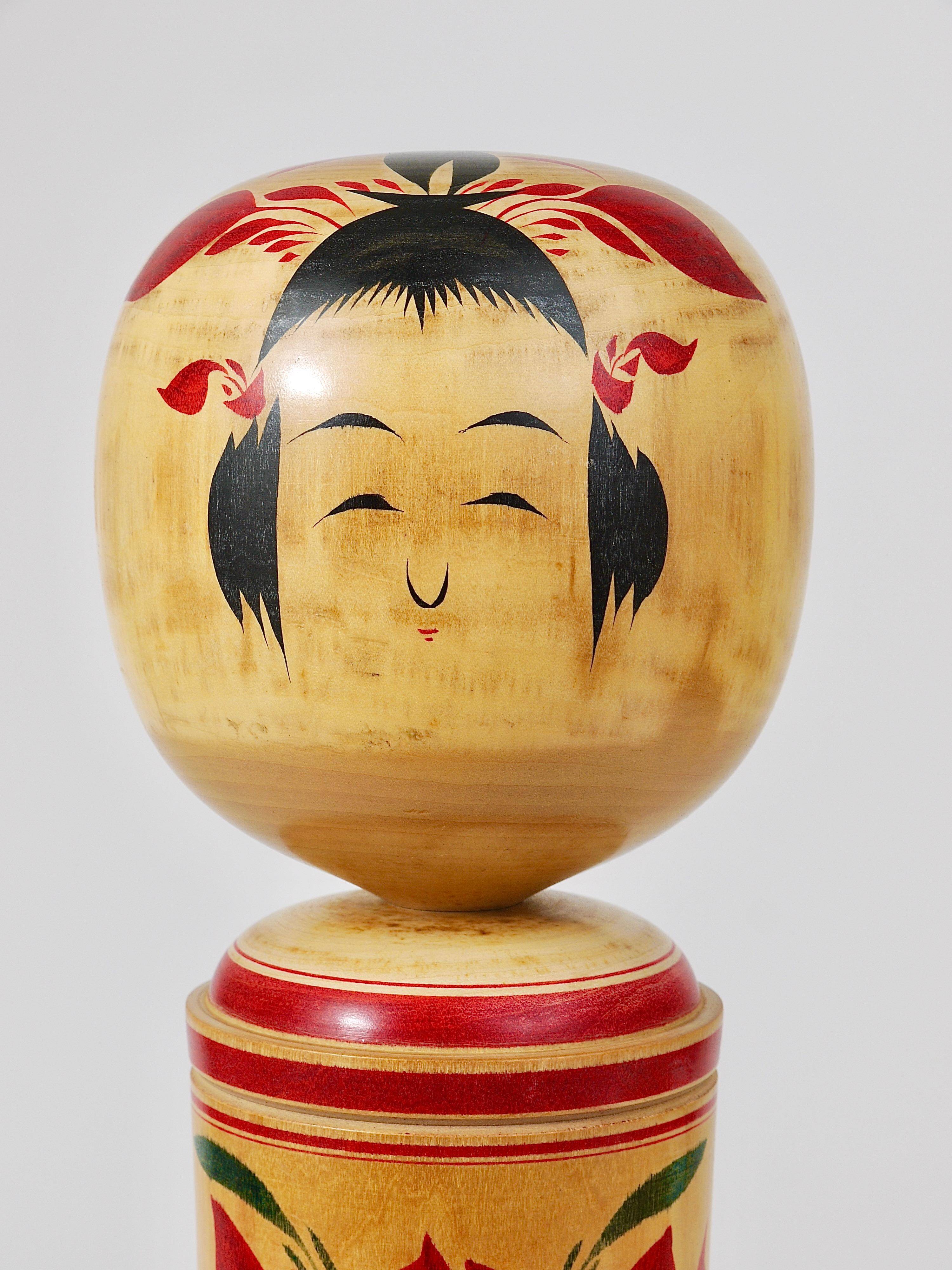 Decorative Naruko Kokeshi doll sculpture from northern Japan, hand-painted.