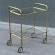 Minimalist solid brass server from the 60s