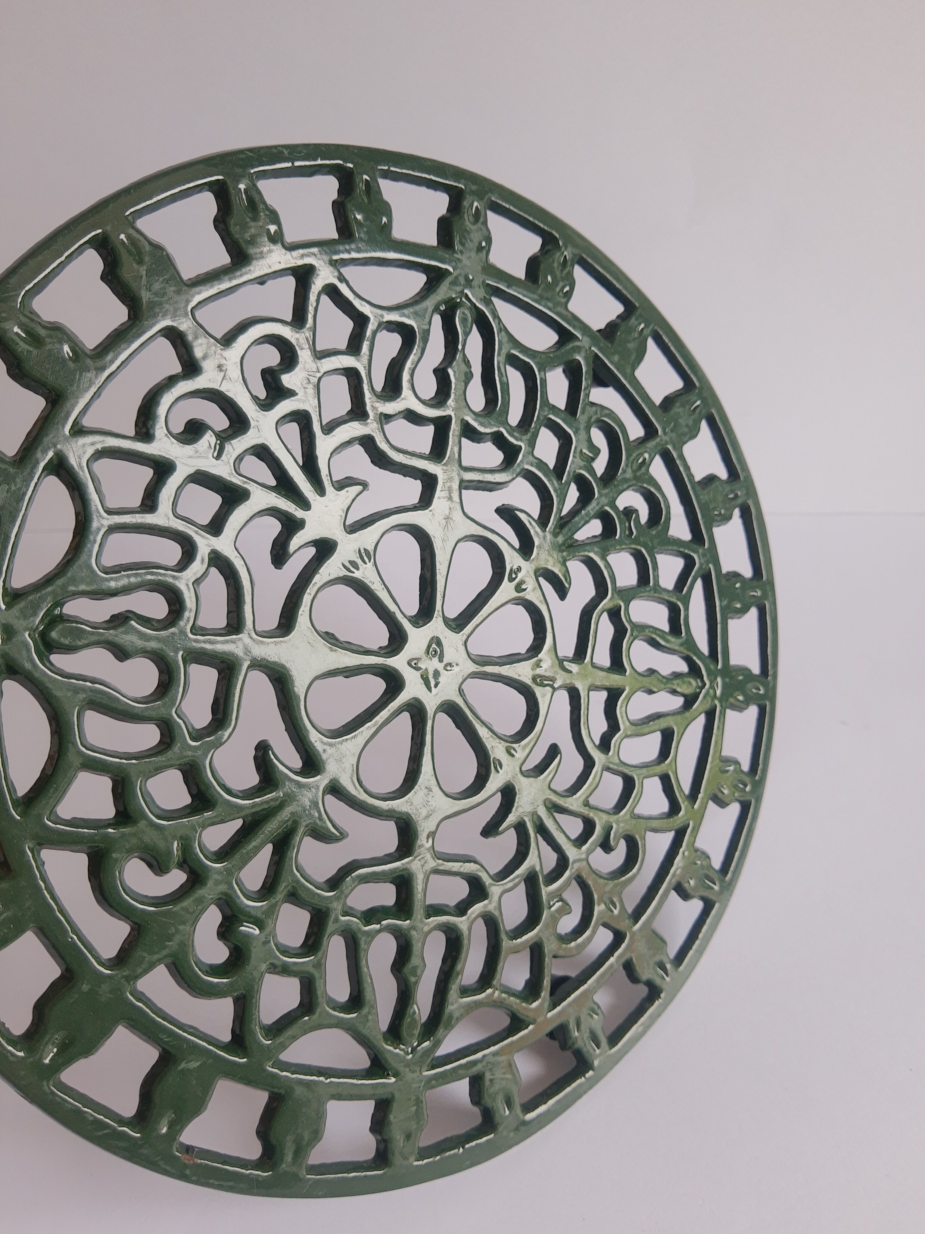 Vintage green cast iron trivet