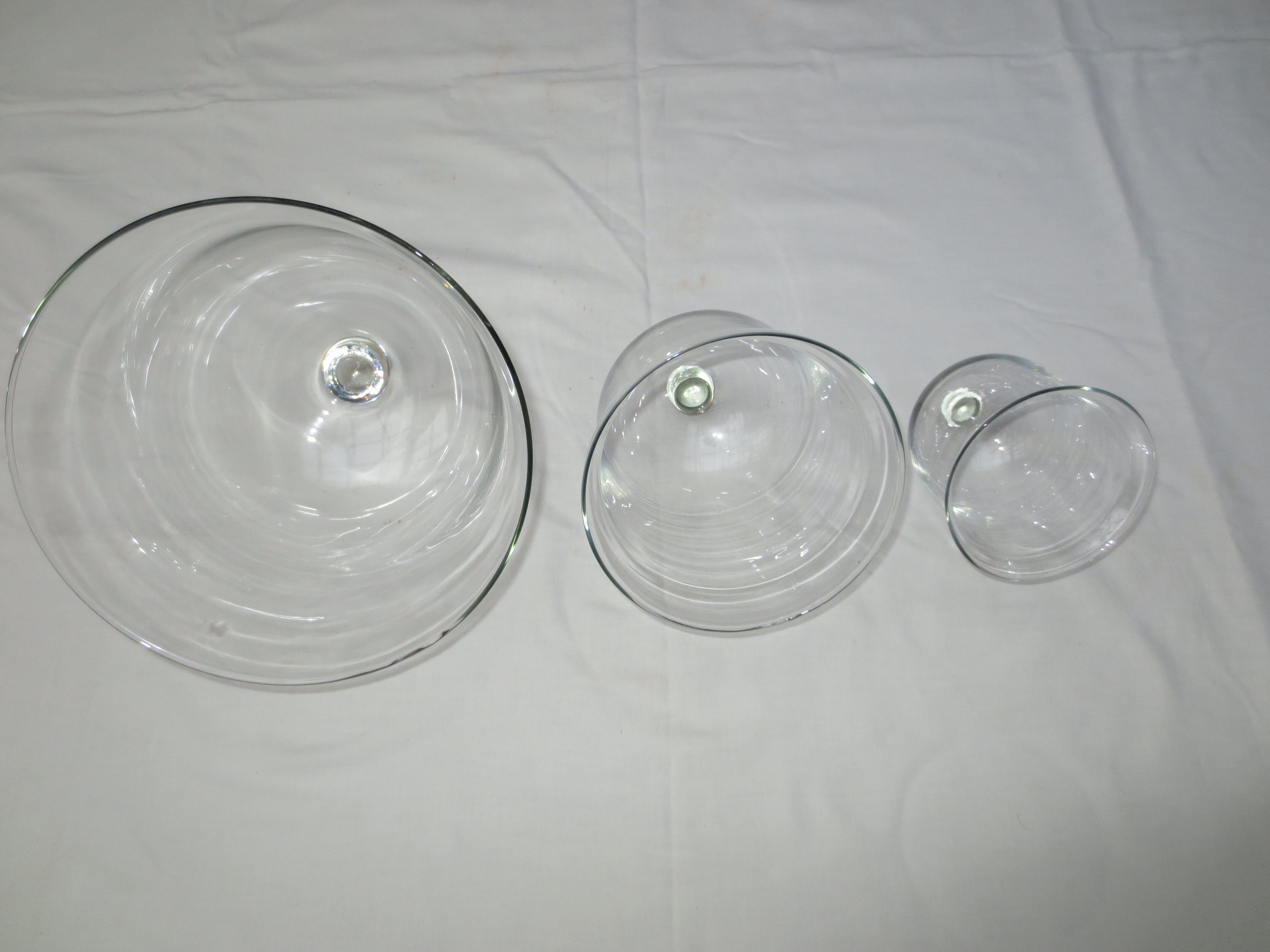 trio of old bells in transparent glass