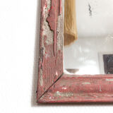 Old mirror in red wood