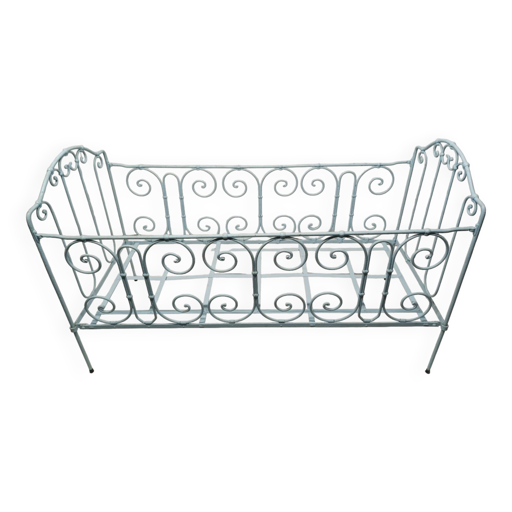 Old children's bed with metal bars