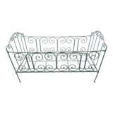 Old children's bed with metal bars