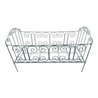 Old children's bed with metal bars