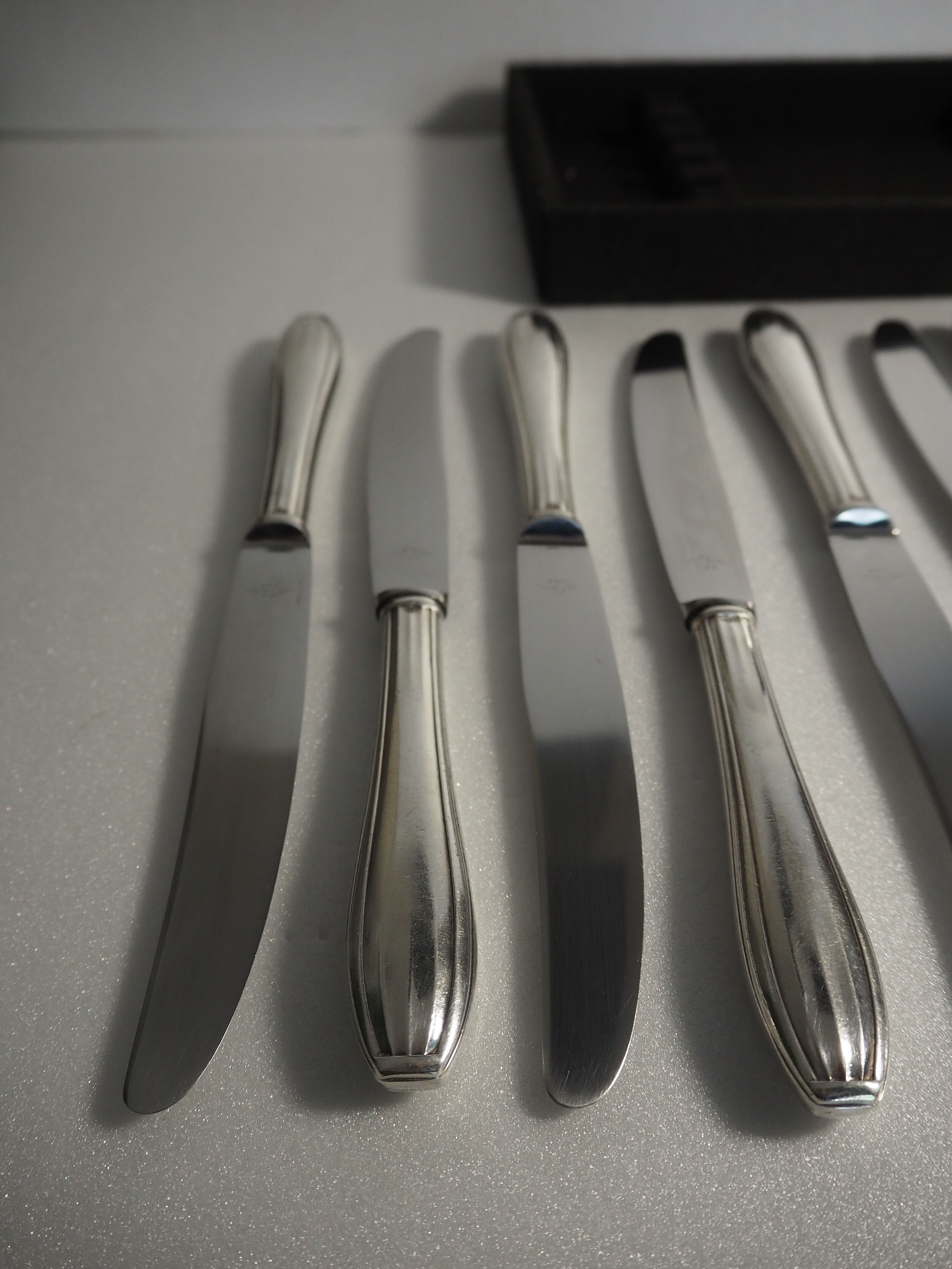 12 SFAM cheese knives in its dark chocolate case