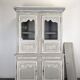 Two-body glass buffet in patinated grey and white oak.
