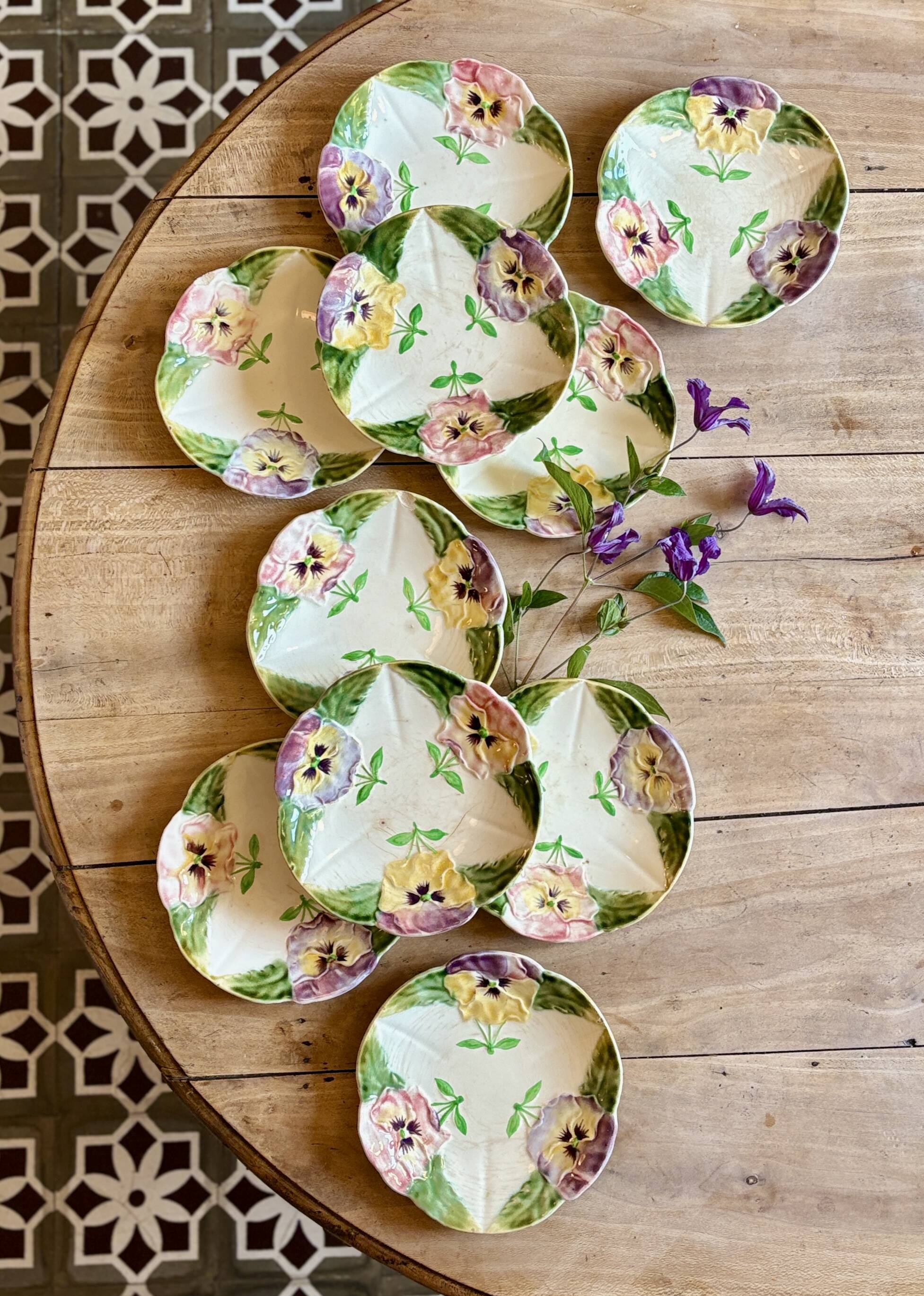 Set of 10 antique slip plates with flower decorations