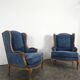 Pair of Louis XV style wingback armchairs in blue velvet.