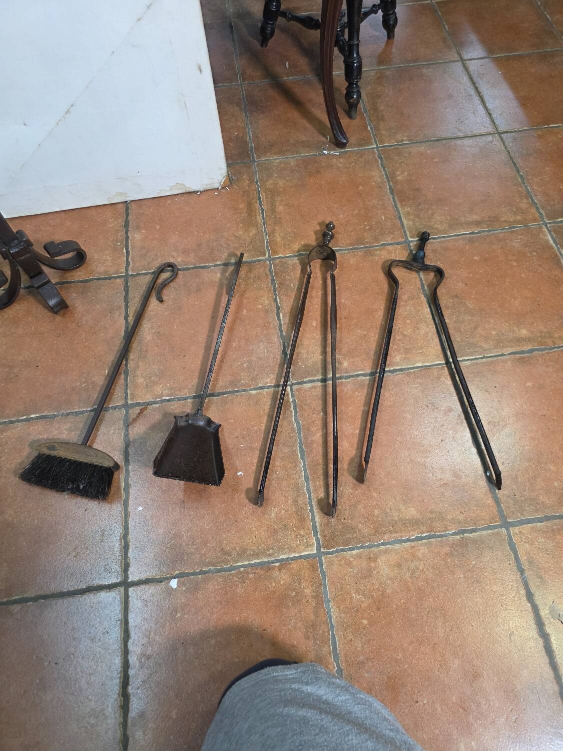 Antique fireplace set in solid wrought iron and brass.