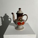 Vintage stoneware teapot with flower and fruit patterns