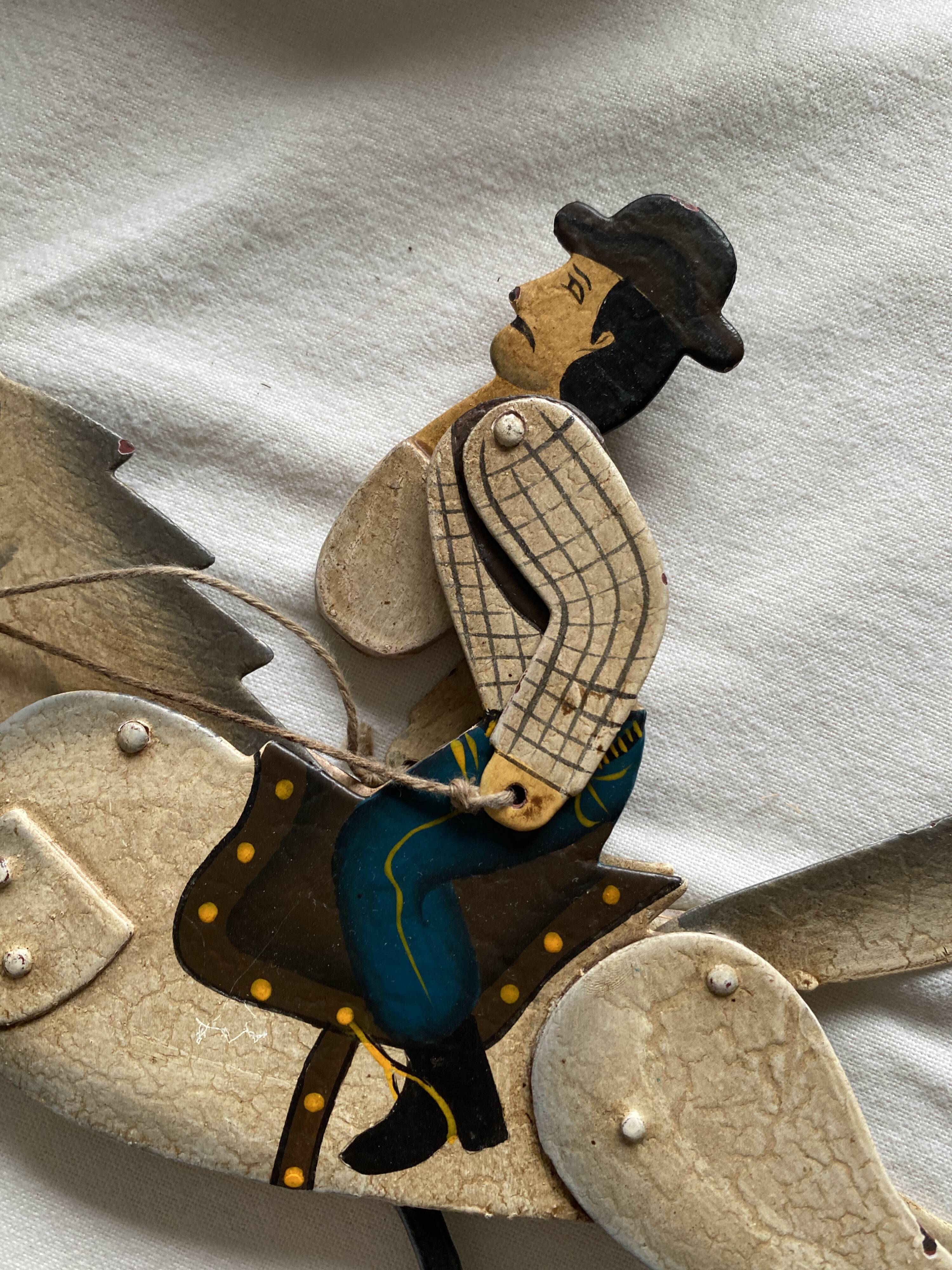 Rider and his horse in enamelled sheet metal rocking