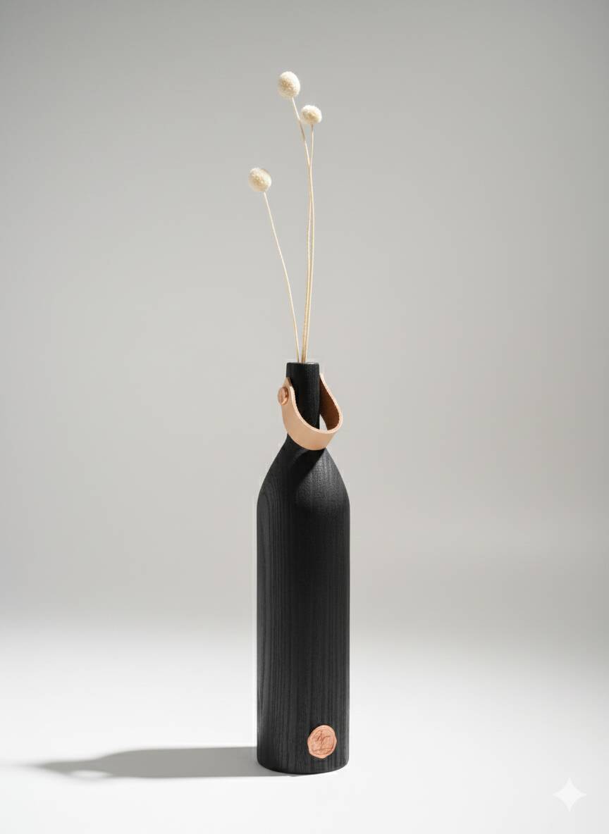 Burnt wood vase for dried flowers, leather and brass handle.