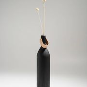 Burnt wood vase for dried flowers, with a leather and brass handle.