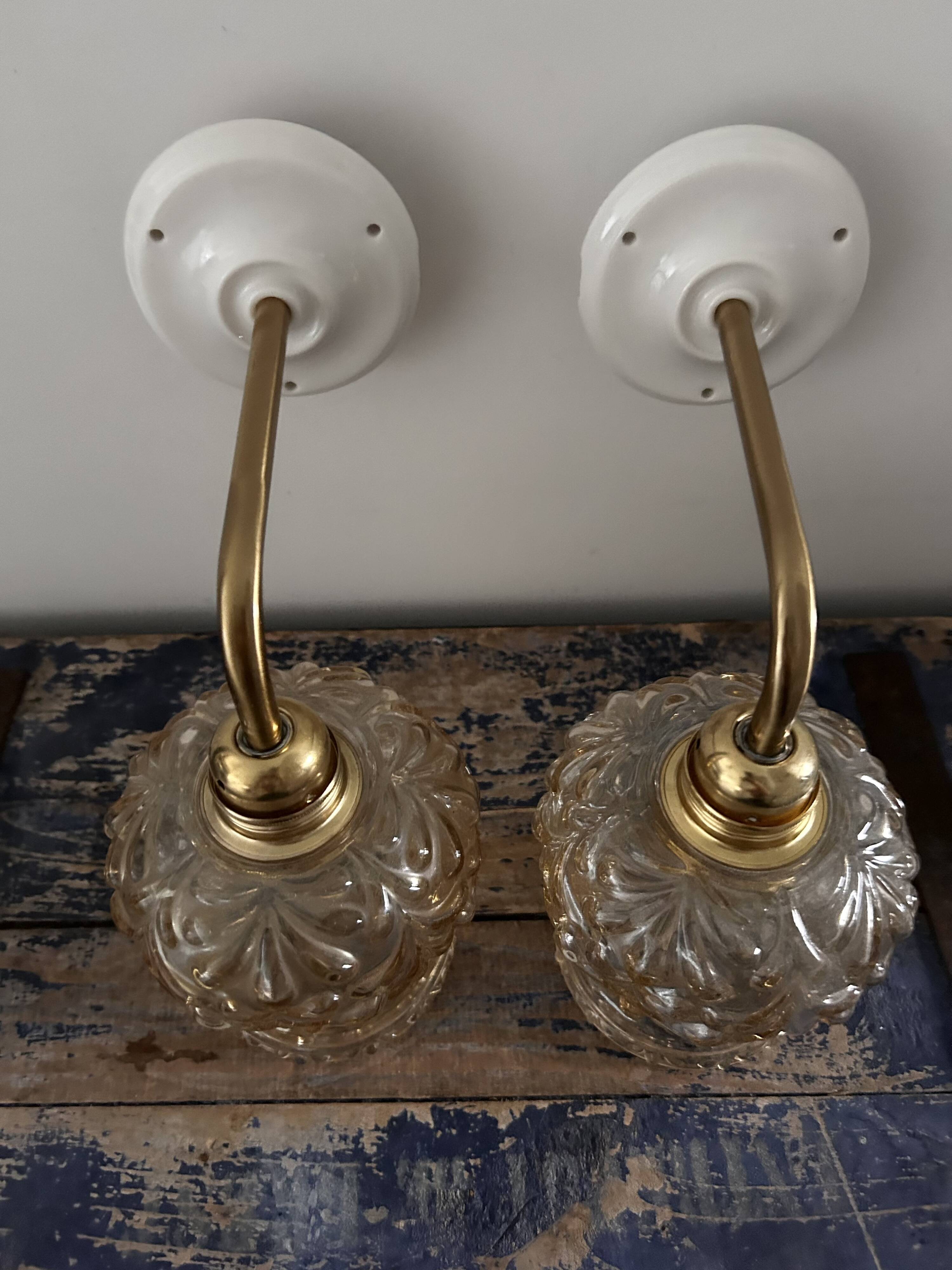 Set of two vintage amber glass wall lights