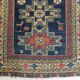 Handwoven Antique - Blue Ground Persian Rug with Bird-like Figures