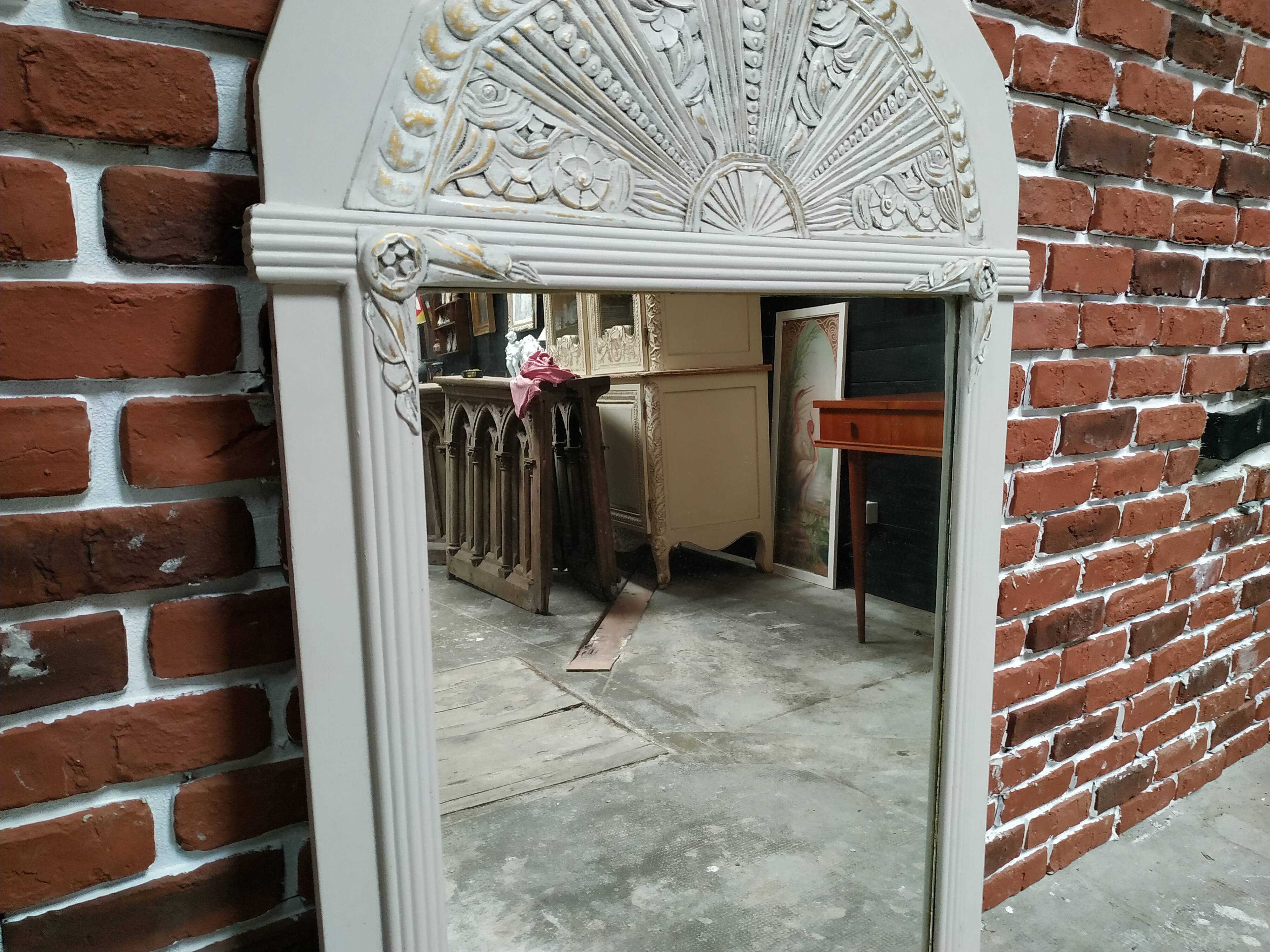 White and gold patinated sculpted mirror