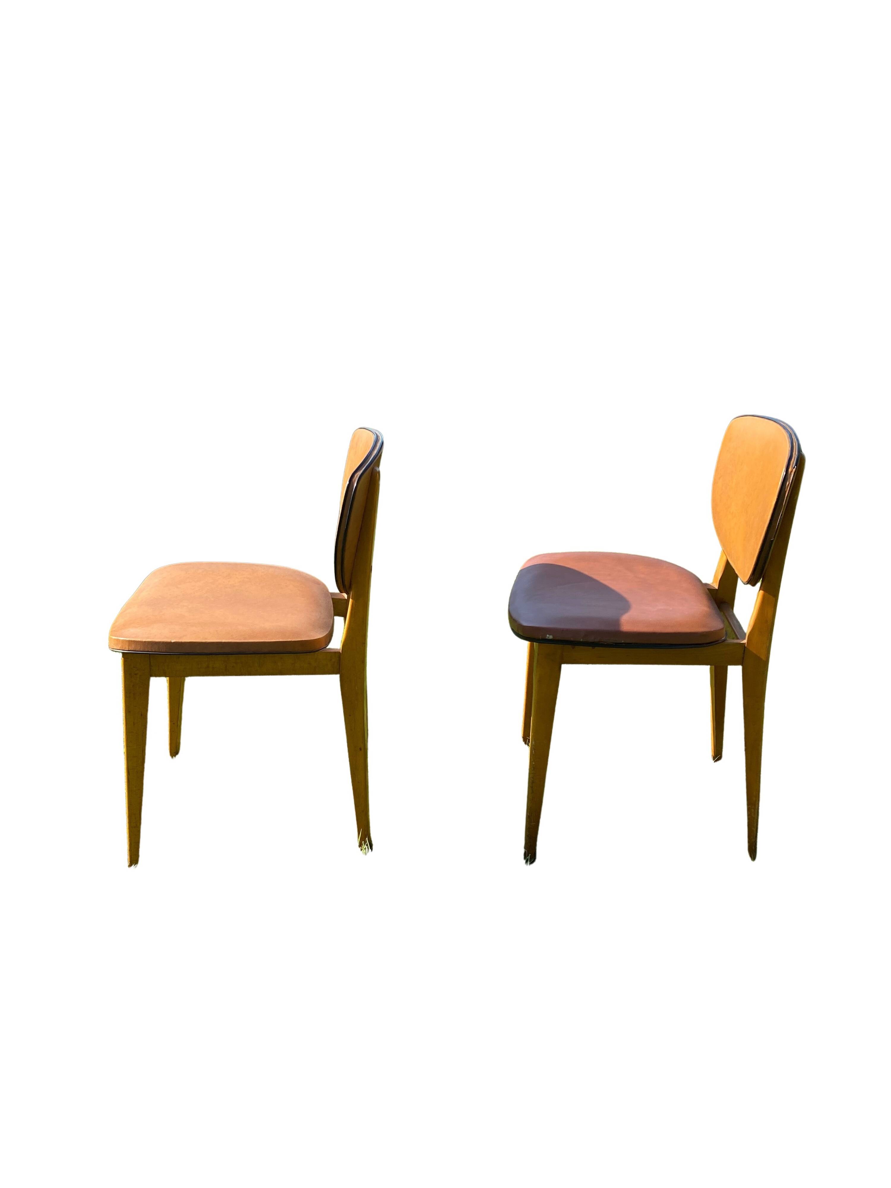 Pair of Scandinavian wood and leather chairs, Circa 1960