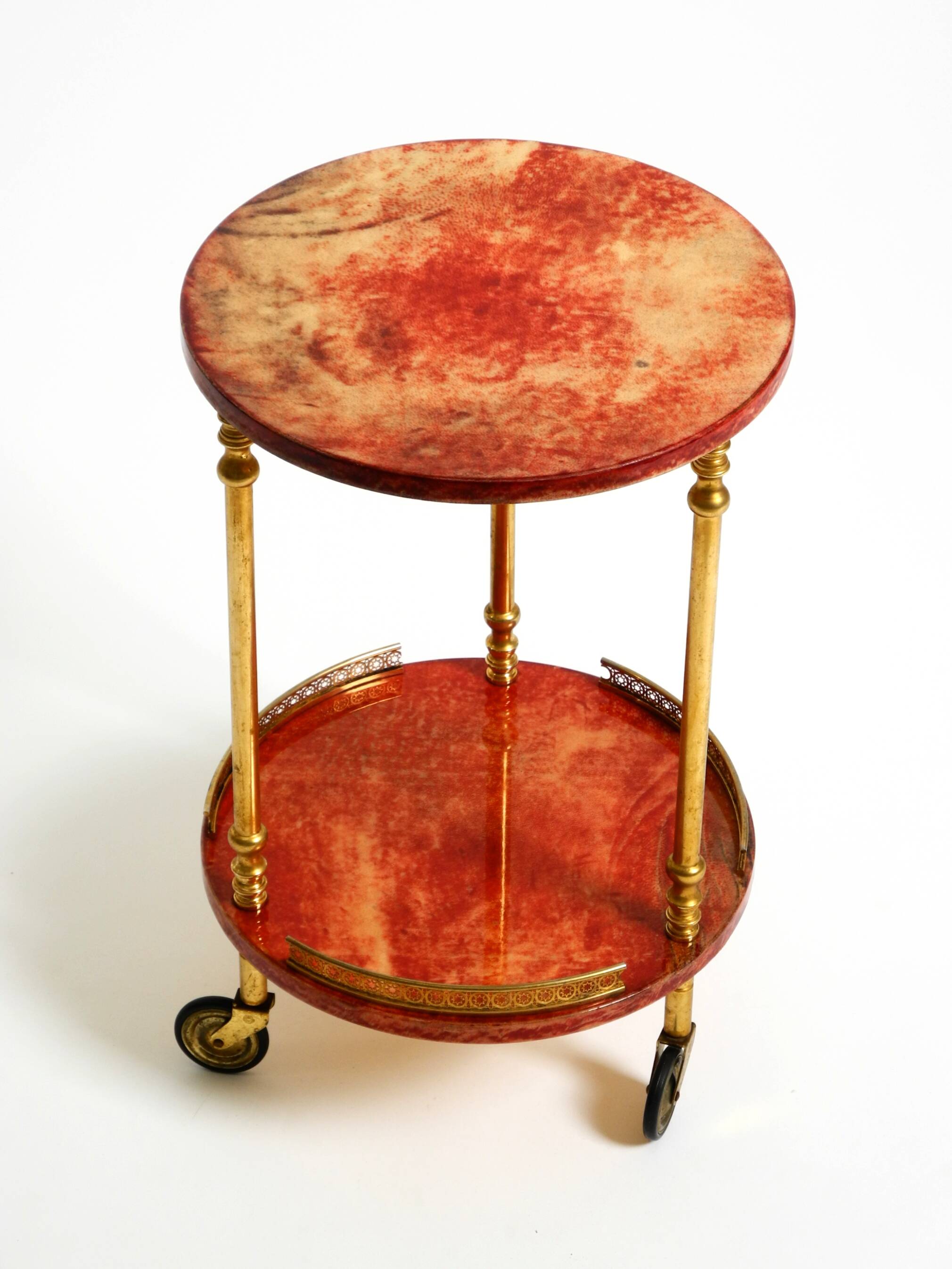 Round, small 1960s Aldo Tura serving or bar trolley in red goatskin leather