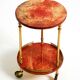 Round, small 1960s Aldo Tura serving or bar trolley in red goatskin leather