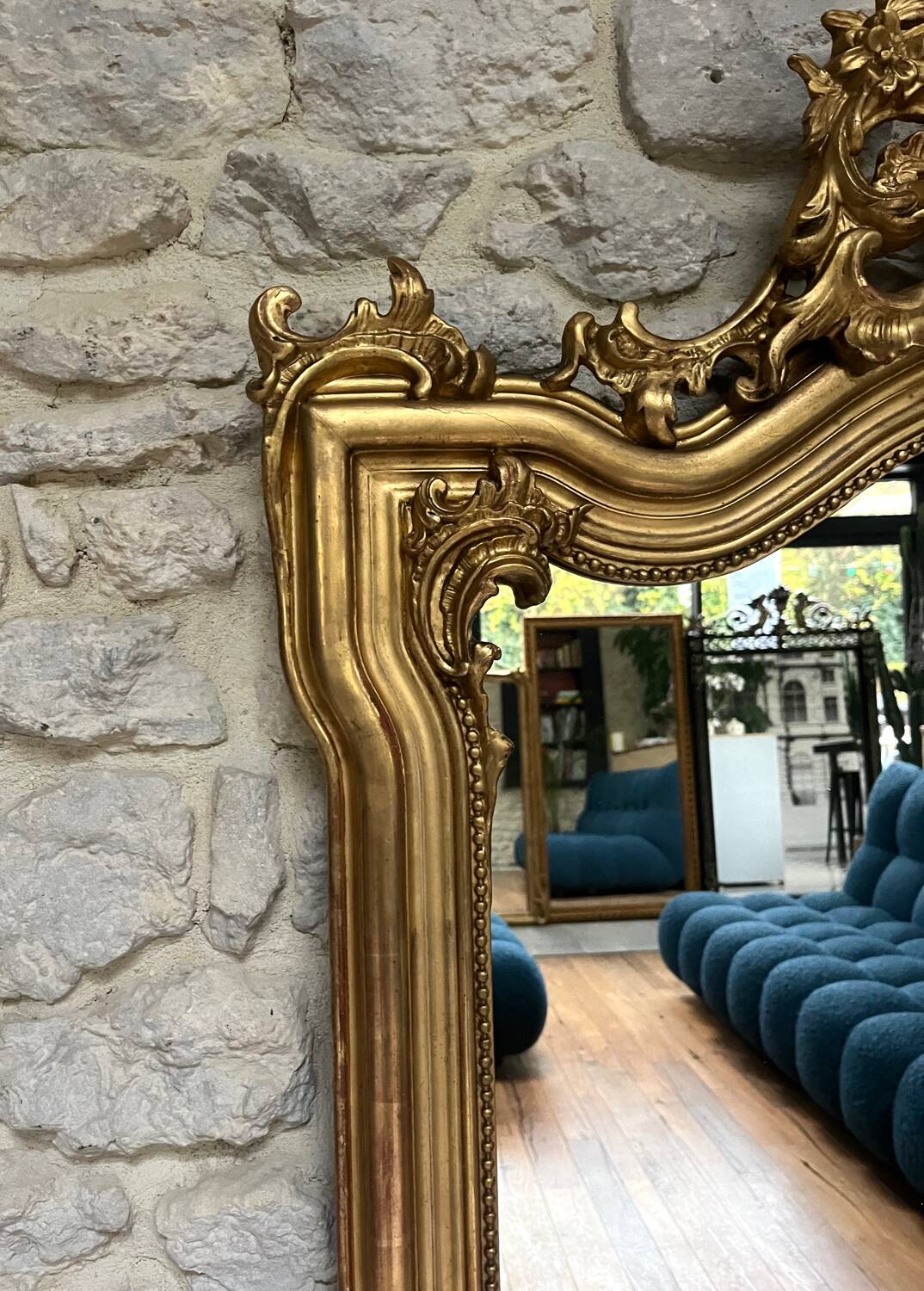 Antique mirror 169/105cm with pediments and pearl detailing in gold leaf.