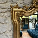 Antique mirror 169/105cm with pediments and pearl detailing in gold leaf.