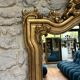Antique mirror 169/105cm with pediments and pearl detailing in gold leaf.