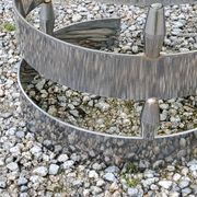 Oval coffee table of the 70s chromed metal base in s smoked glass top