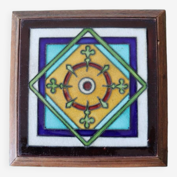 Old multicolored tile trivet