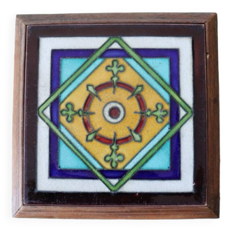 Old multicolored tile trivet