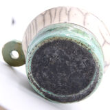 Atypical cup in turquoise and gray raku with signature