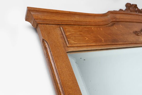 Miroir Art Déco en chêne à décors sculptés et miroir à facettes, années 1930