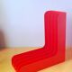 33 rpm vinyl record rack, in orange 70s plastic.