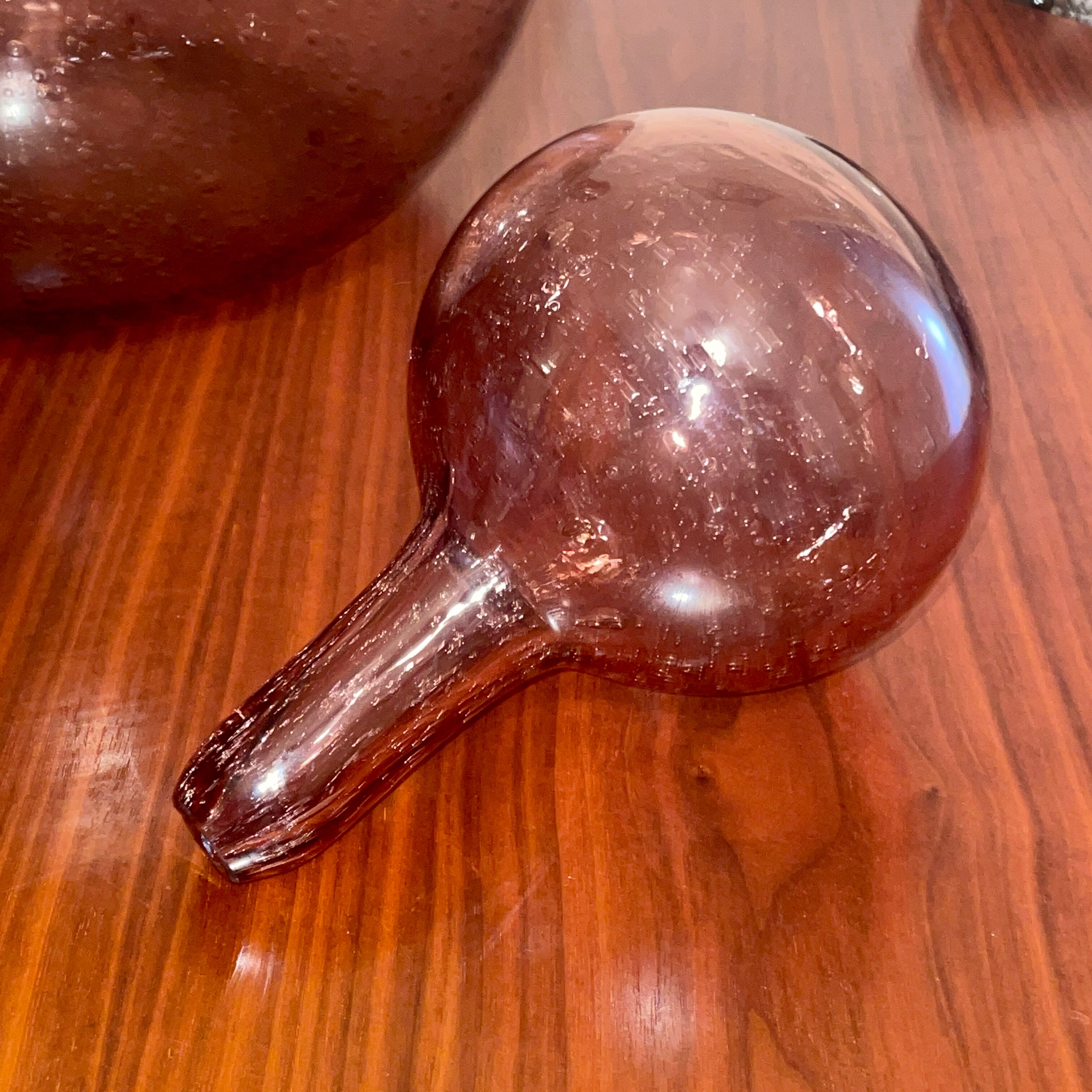 Bottle  in blown and bubbled glass