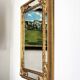 Grand miroir italien doré en bois à verre biseauté