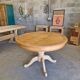 Round cherry table with 2 extensions.