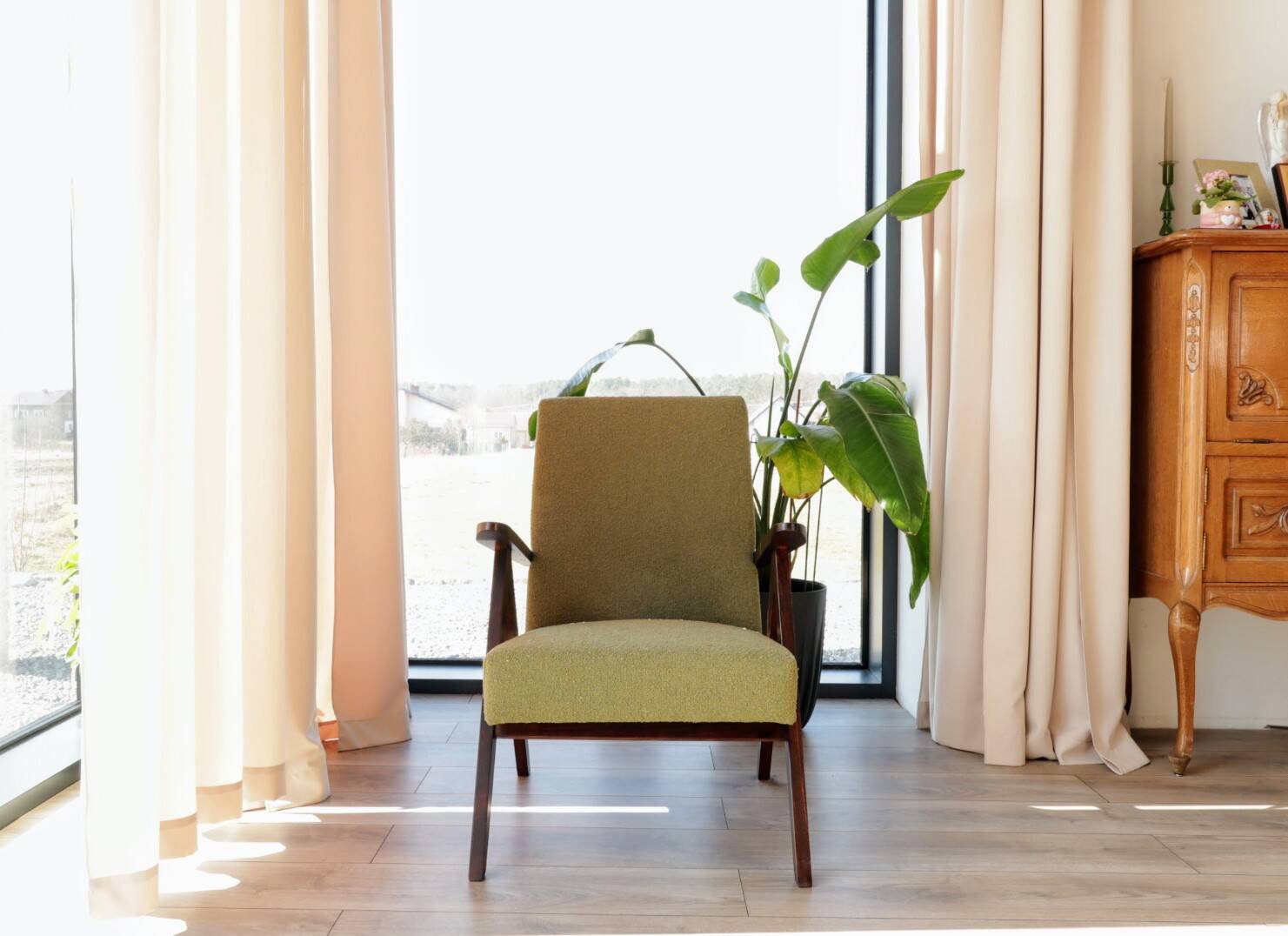 Vintage armchair in moss green bouclé design by H. Lis.