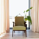 Vintage armchair in moss green bouclé design by H. Lis.