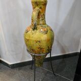 Large decorative vase with handles – painted floral design – on a metal stand