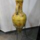 Large decorative vase with handles – painted floral design – on a metal stand