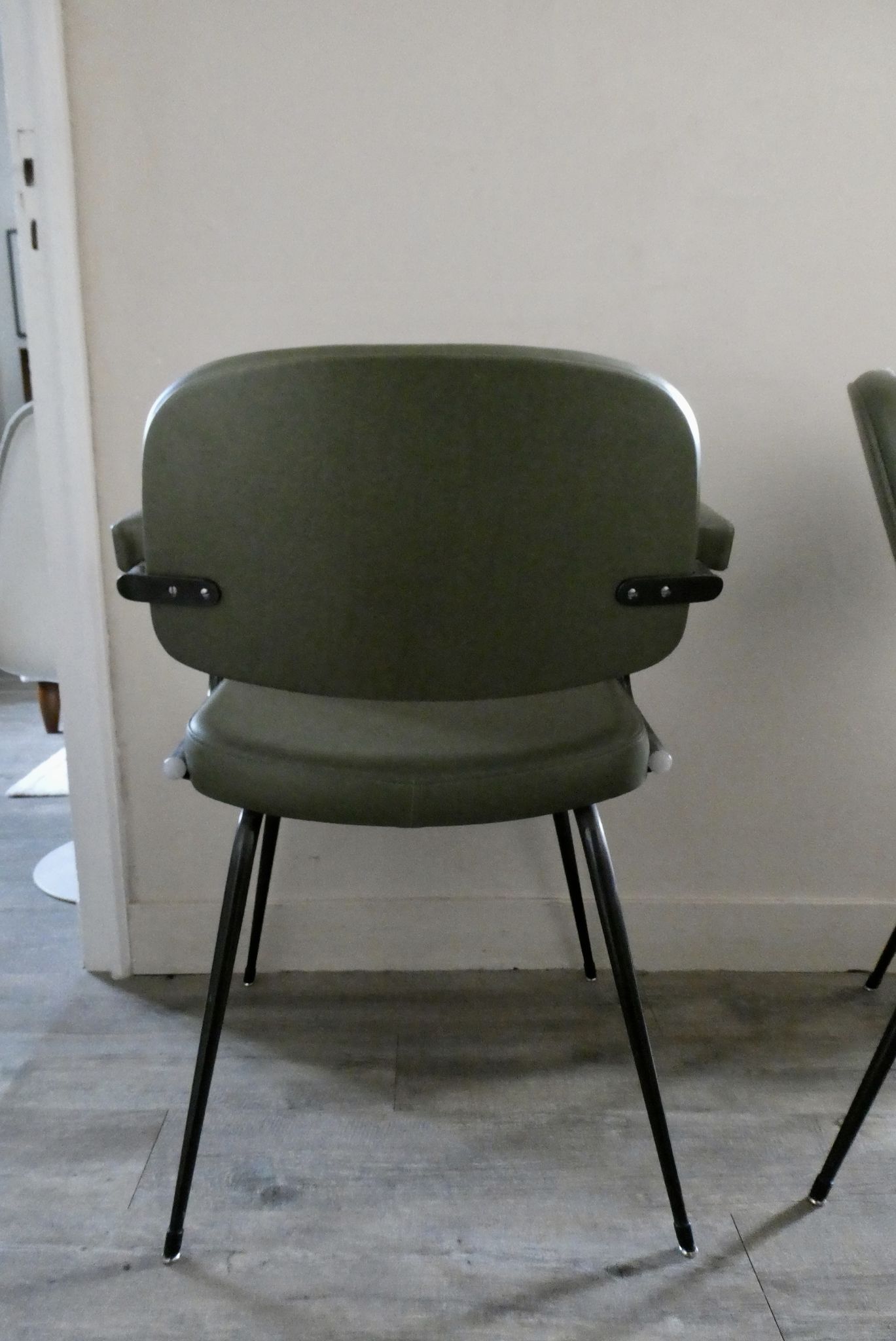 Pair of khaki green metal and skai armchairs from the 1960s