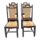 4 Basque solid wood dining chairs with carved straw seats.