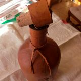 Leather covered bottle with stopper