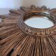Miroir soleil vintage , en bois doré .