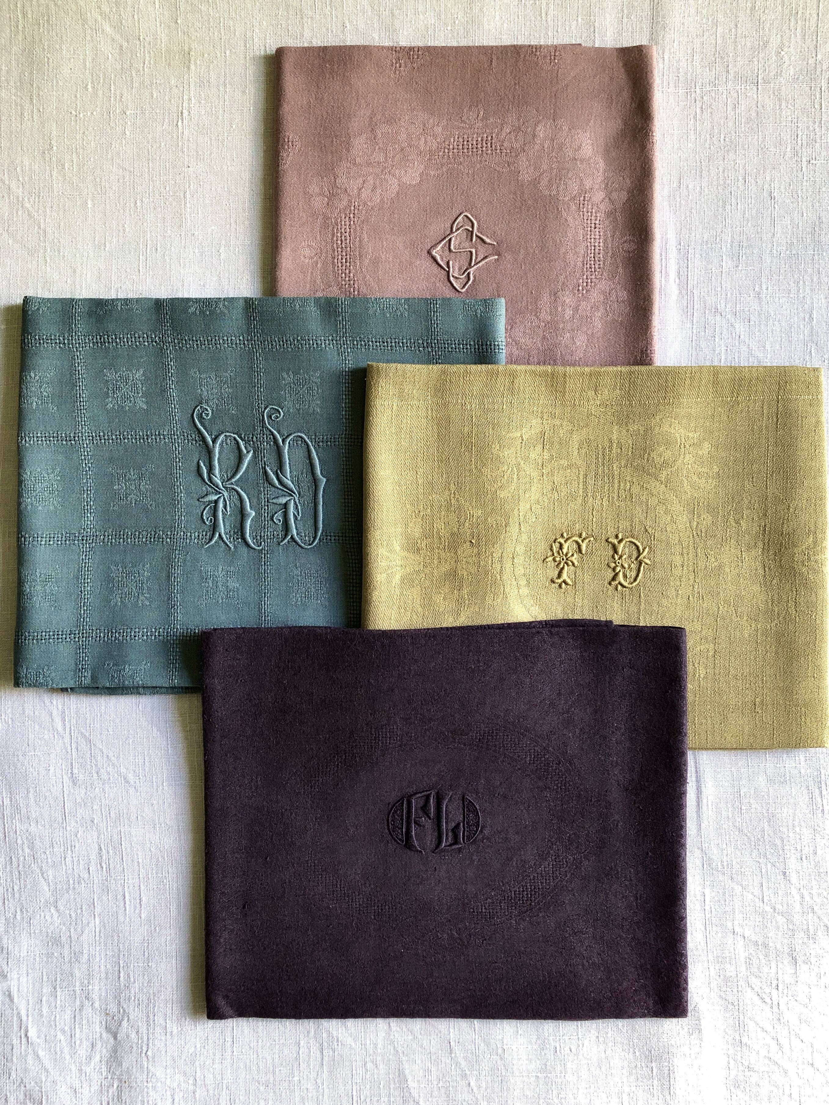 Suite of four tinted antique napkins
