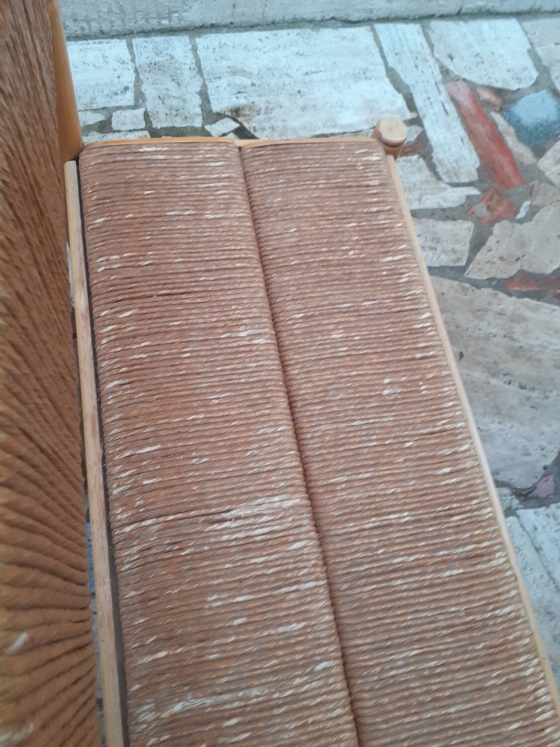 2 wooden and straw benches